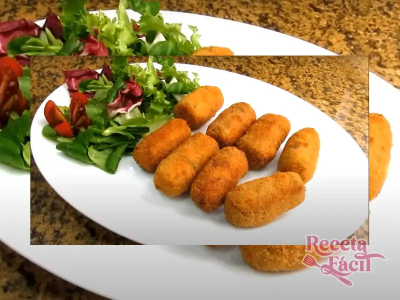Croquetas Caseras de Puchero doradas y crujientes sobre plato blanco